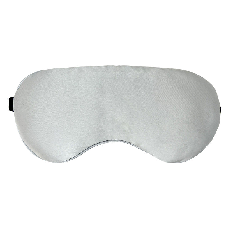 Lavarest Eye Pillow – light grey satin contoured eye mask with black elastic strap, shown flat against a white background